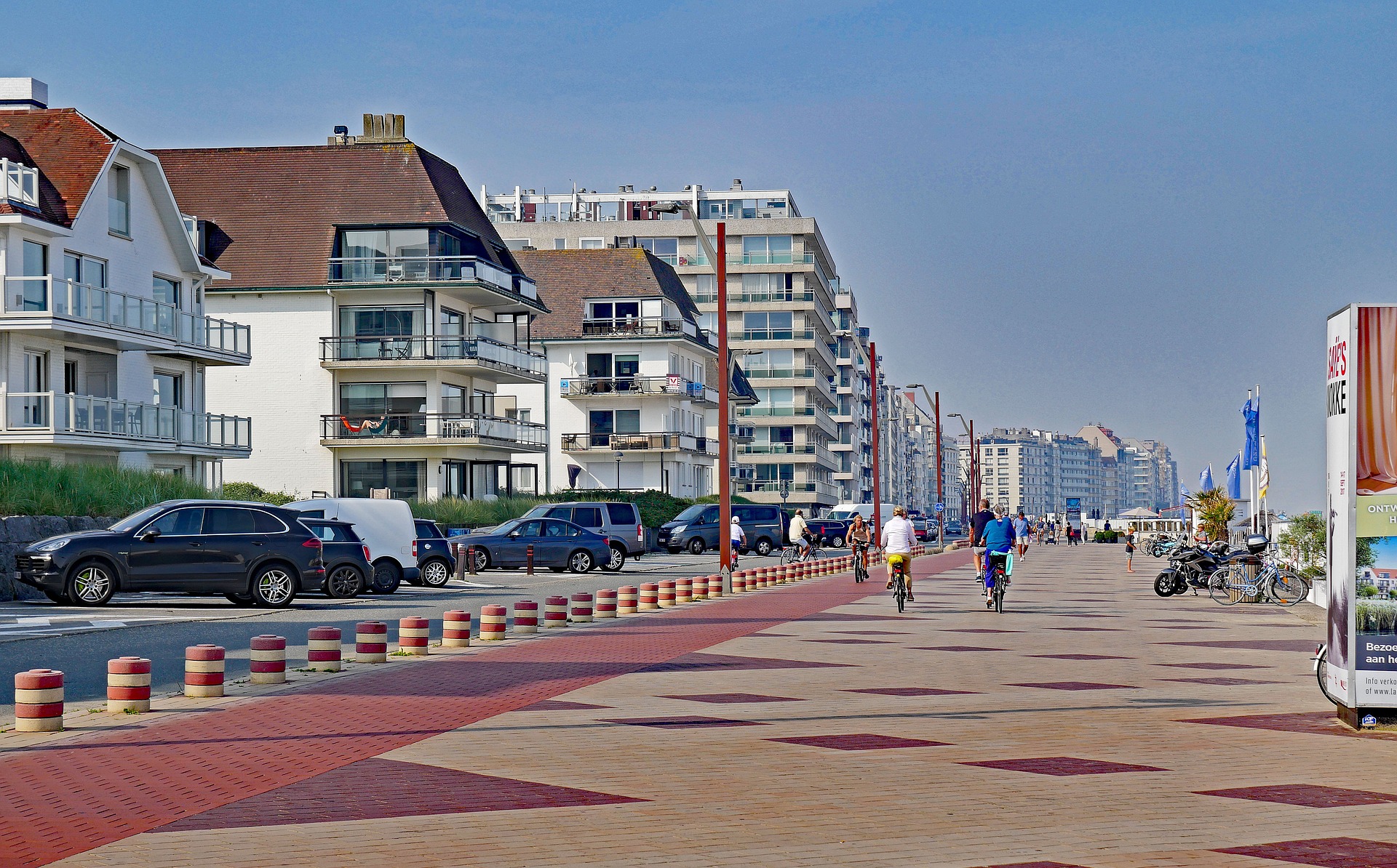 People walking and cycling along the seafront in Knokke-Heist